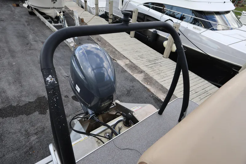 Slide: The Image of 2019 Veranda 22 VR boat with Yamaha outboard motor docked at marina. - 24