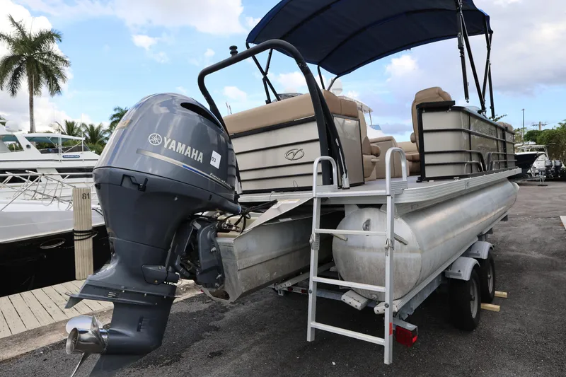 Slide: The Image of 2019 Veranda 22 VR pontoon boat with Yamaha outboard motor on trailer. - 4