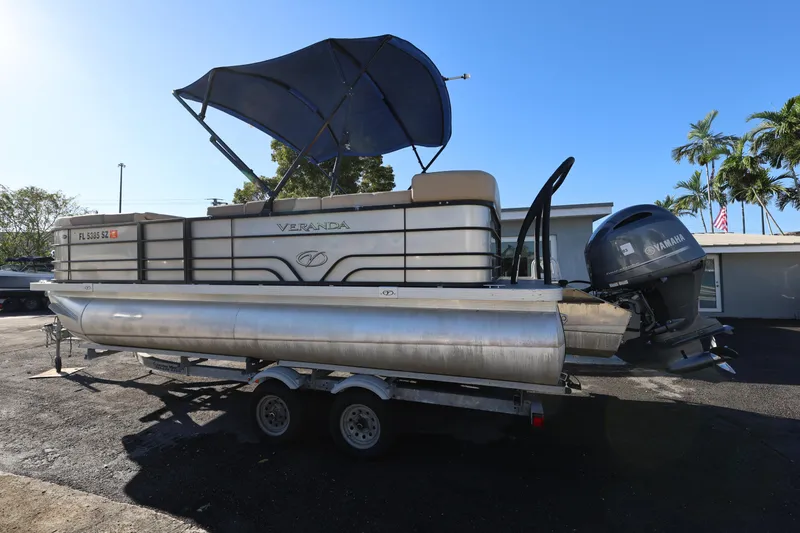 Slide: The Image of 2019 Veranda 22 VR pontoon boat with Yamaha motor on trailer, sunny day. - 8