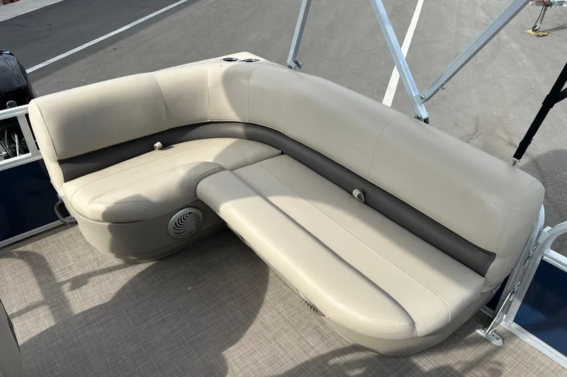 Slide: The Image of 2021 Sun Tracker Bass Buggy 16 XL pontoon boat seating area, beige upholstery. - 11