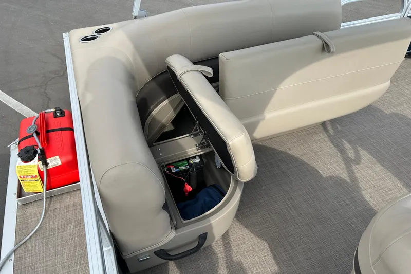 Slide: The Image of 2021 Sun Tracker Bass Buggy 16 XL pontoon boat with open storage compartment and fuel tank. - 15