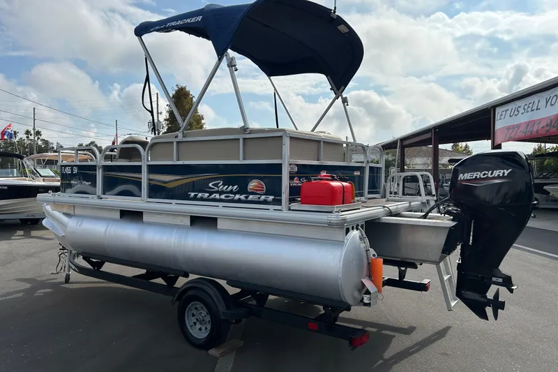 Slide: The Image of 2021 Sun Tracker Bass Buggy 16 XL pontoon boat with Mercury outboard motor. - 4