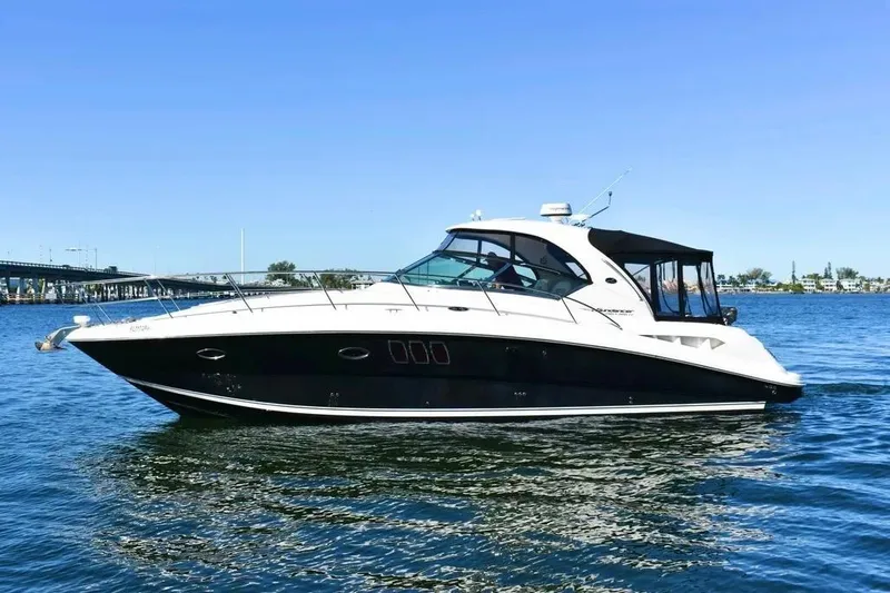 The Image of 2010 Sea Ray 390 Sundancer yacht cruising on a sunny day. - 0