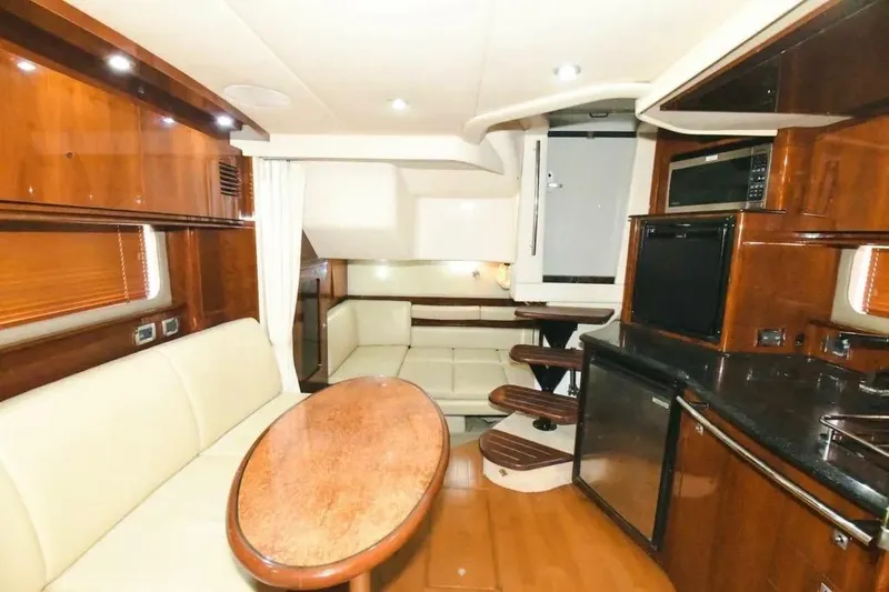 Slide: The Image of Luxurious interior of 2010 Sea Ray 390 Sundancer yacht with elegant wood finishes. - 11