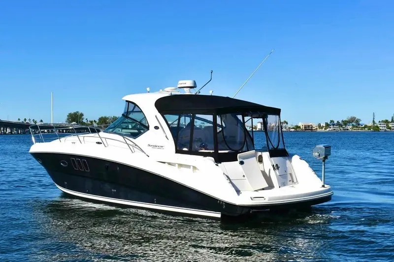 Slide: The Image of 2010 Sea Ray 390 Sundancer yacht cruising on a sunny day in open water. - 2