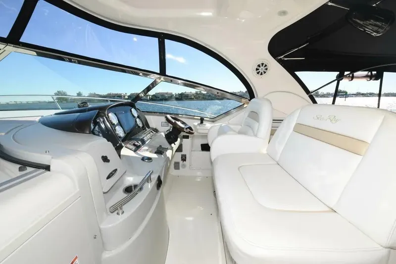 Slide: The Image of Luxurious interior of 2010 Sea Ray 390 Sundancer yacht with plush seating and modern dashboard. - 5