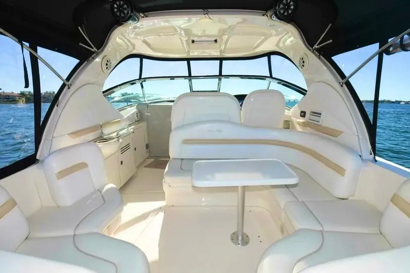 Slide: The Image of Interior of 2010 Sea Ray 390 Sundancer yacht with white seating and table. - 7