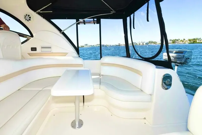 Slide: The Image of Luxurious interior of 2010 Sea Ray 390 Sundancer yacht with white seating and table. - 8