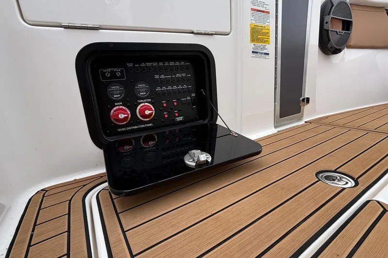 Slide: The Image of 2022 MasterCraft X26 boat electrical panel on teak deck. - 25