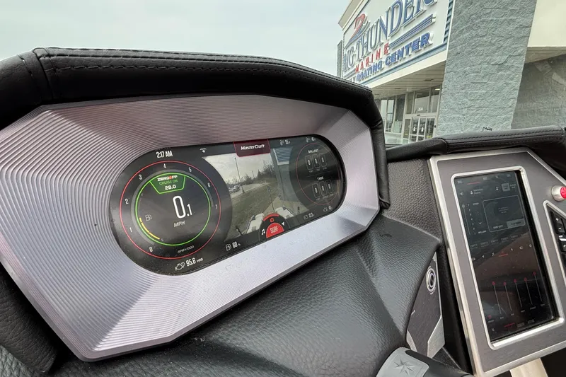 Slide: The Image of 2022 MasterCraft X26 dashboard with digital display at Big Thunder Marine Center. - 36