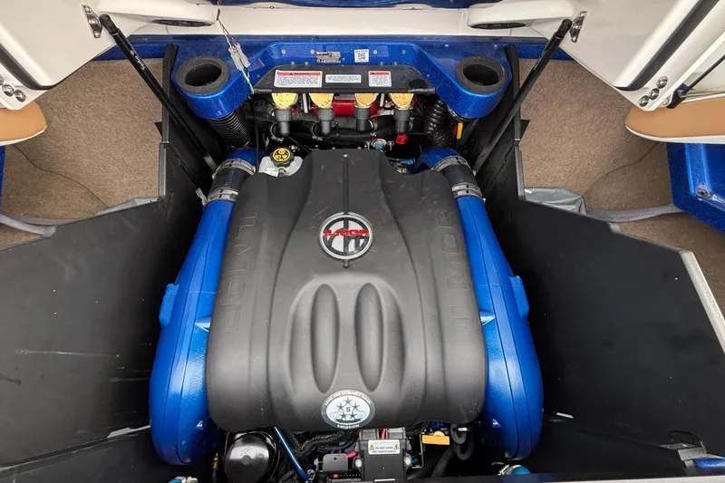 Slide: The Image of 2022 MasterCraft X26 engine compartment with Ilmor marine engine, showcasing blue accents. - 44