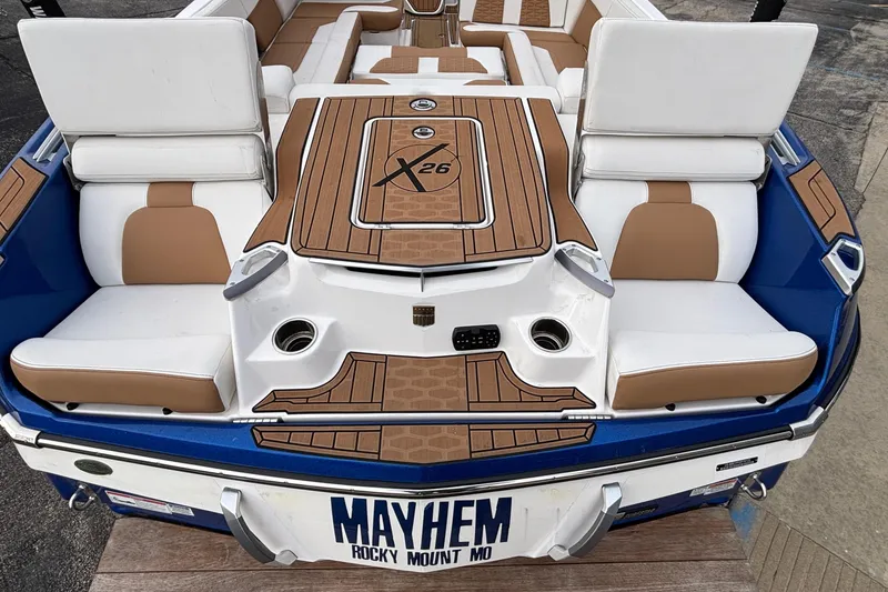 Slide: The Image of 2022 MasterCraft X26 boat with custom seating and "MAYHEM" license plate. - 47