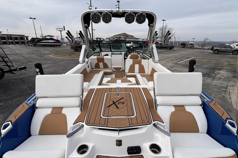 Slide: The Image of 2022 MasterCraft X26 boat interior with luxurious seating and modern design. - 49