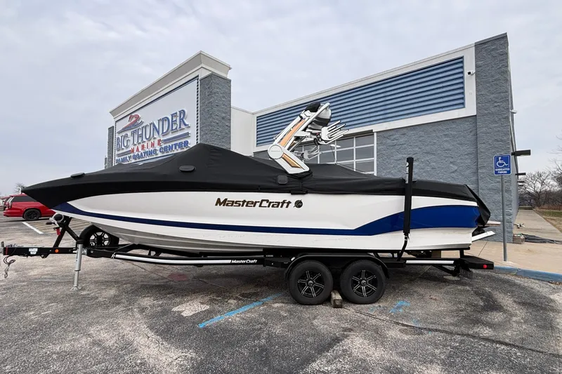 Slide: The Image of 2022 MasterCraft X26 boat on trailer at Big Thunder Marine center. - 5