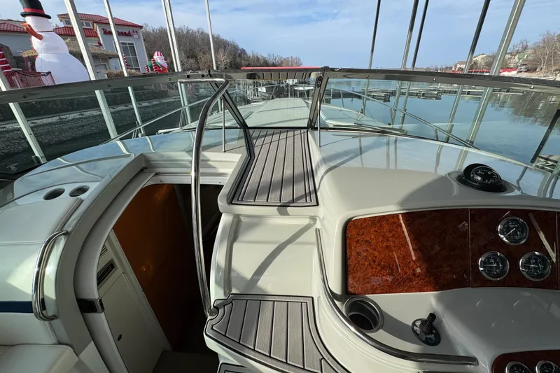 Slide: The Image of 2005 Formula 400 Super Sport boat interior with dashboard and open cabin door. - 16