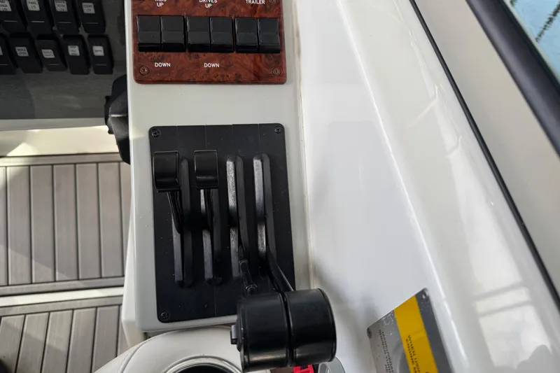 Slide: The Image of Control panel of a 2005 Formula 400 Super Sport boat with throttle levers. - 28