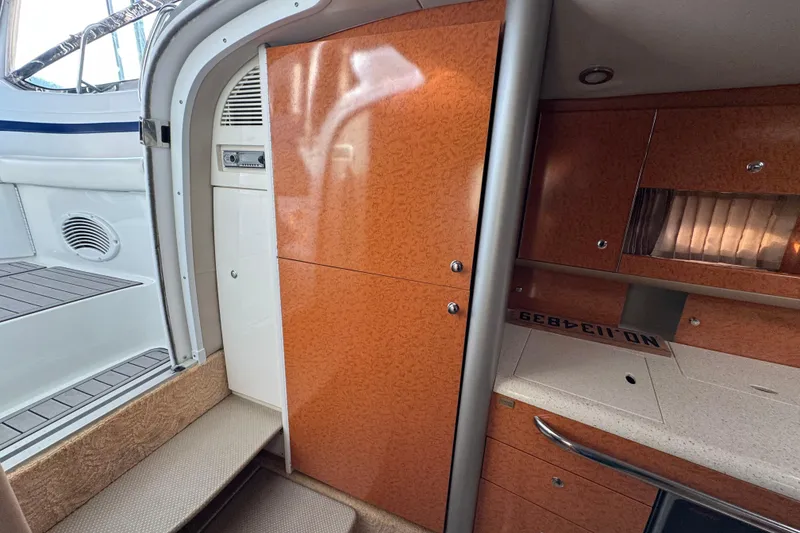 Slide: The Image of Interior of a 2005 Formula 400 Super Sport boat, featuring wood cabinetry and modern design. - 38