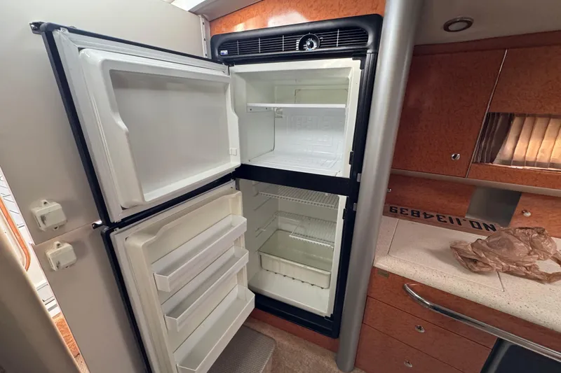 Slide: The Image of Open refrigerator in 2005 Formula 400 Super Sport boat interior. - 39