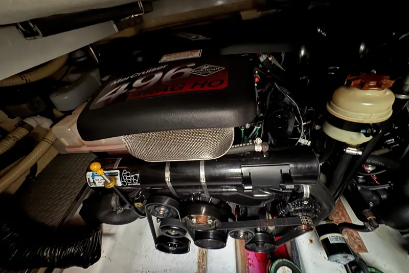 Slide: The Image of Engine compartment of a 2005 Formula 400 Super Sport boat, featuring a MerCruiser 496 MAG HO engine. - 46
