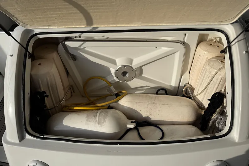 Slide: The Image of Storage compartment of a 2005 Formula 400 Super Sport boat with fenders and ropes. - 9