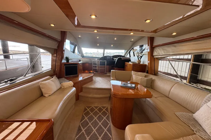 Slide: The Image of Luxurious interior of a 2006 Sunseeker Manhattan 50 yacht with elegant seating and wood finishes. - 11