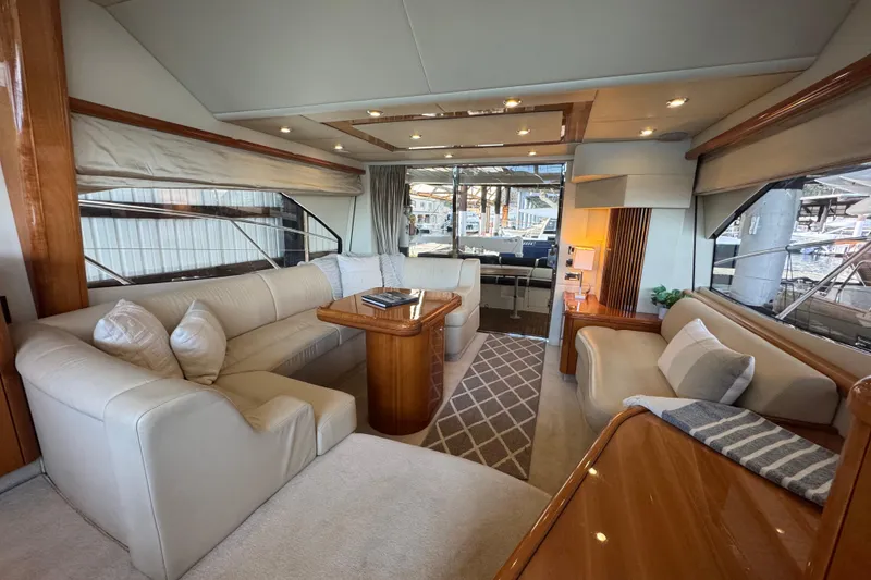 Slide: The Image of Luxurious interior of a 2006 Sunseeker Manhattan 50 yacht with elegant seating and wood finishes. - 12