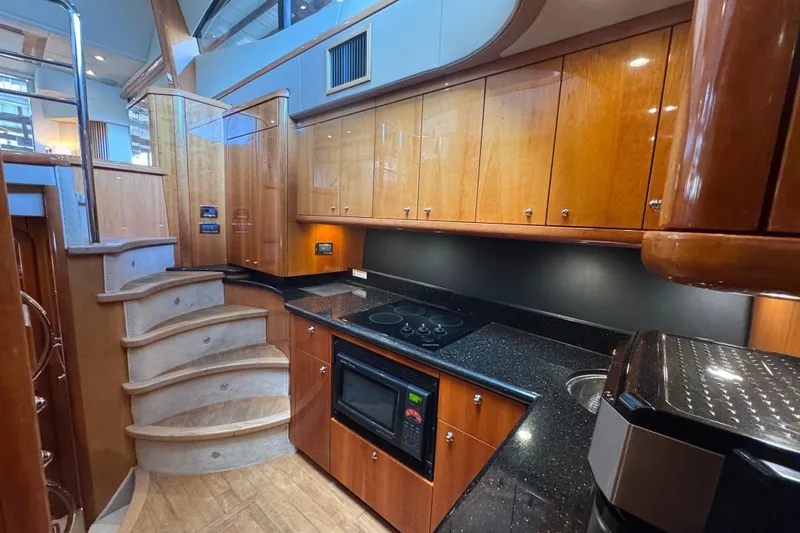 Slide: The Image of Luxurious kitchen interior of 2006 Sunseeker Manhattan 50 yacht with wooden cabinetry. - 16