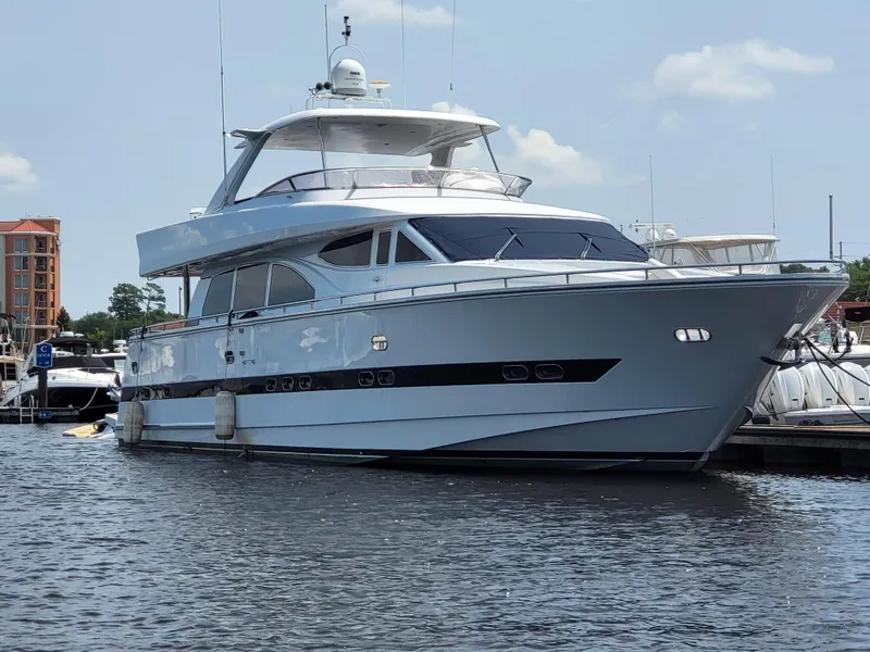 The Image of Horizon 74 Motor Yacht 2000 docked on a sunny day, showcasing sleek design and luxury. - 0