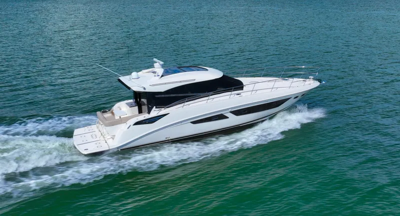 Slide: The Image of 2016 Sea Ray 470 Sundancer cruising on open water, showcasing sleek design and luxury. - 10