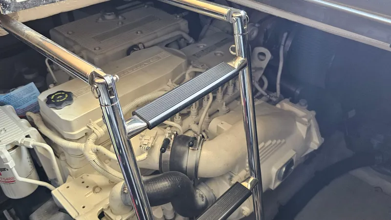 Slide: The Image of Engine compartment of a 2016 Sea Ray 470 Sundancer with visible ladder and components. - 34