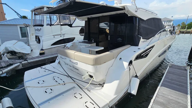 Slide: The Image of 2016 Sea Ray 470 Sundancer yacht docked at marina, rear view. - 42