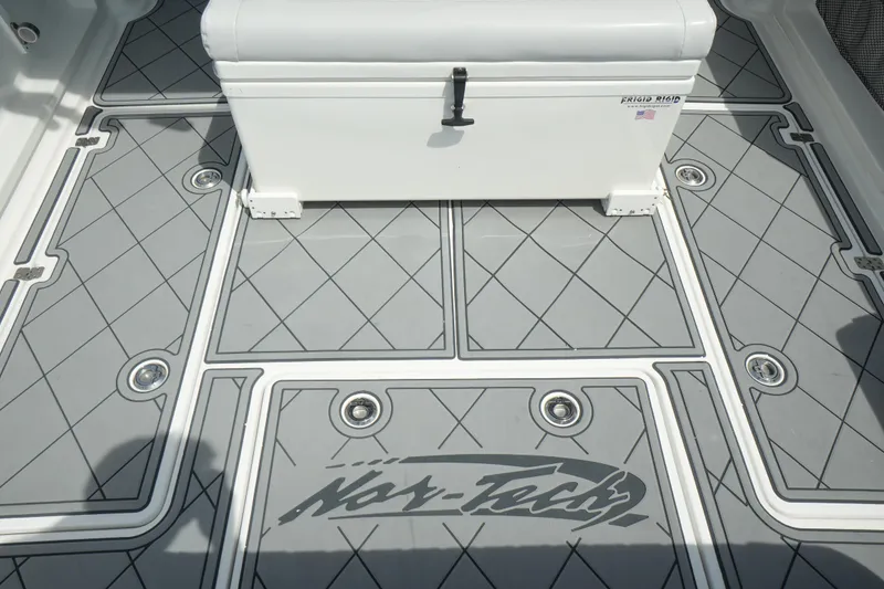 Slide: The Image of 2020 Nor-Tech 390 Sport Center Console on open water, featuring luxurious seating and powerful engines. - 25