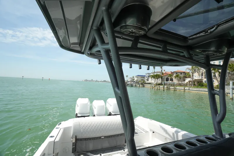 Slide: The Image of 2020 Nor-Tech 390 Sport Center Console interior with speakers and steering wheel view. - 45