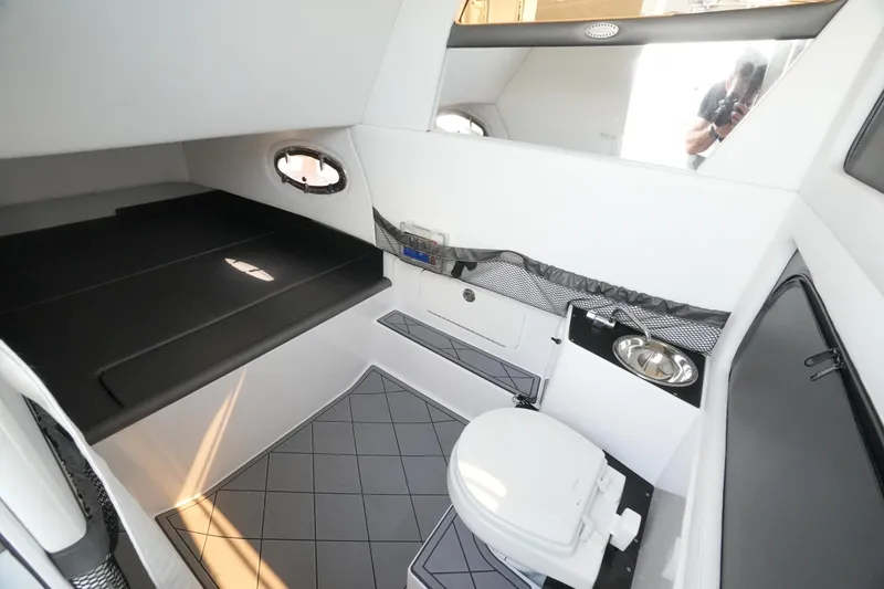 Slide: The Image of Interior of 2020 Nor-Tech 390 Sport Center Console, featuring modern cabin amenities. - 52