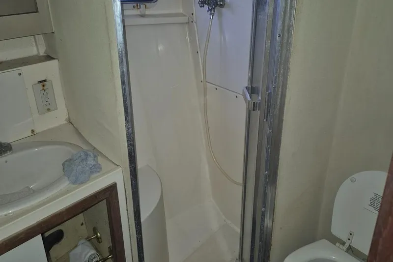 Slide: The Image of Bathroom interior of 1982 Bertram 38 Convertible yacht with shower and sink. - 25