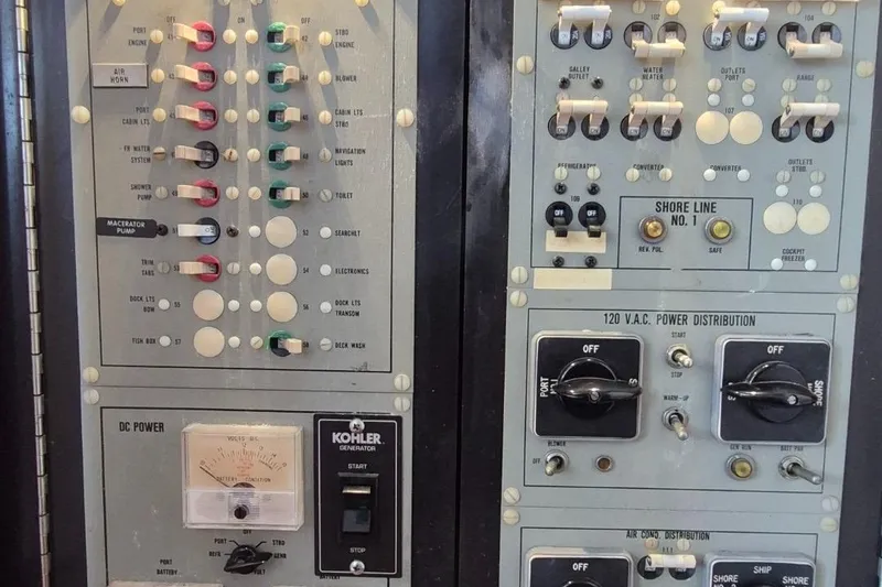 Slide: The Image of Control panel of a 1982 Bertram 38 Convertible boat with various switches and gauges. - 41
