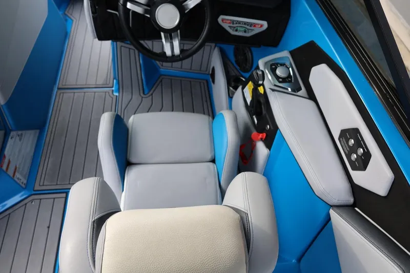 Slide: The Image of 2022 Nautique Super Air Nautique S23 dashboard with touchscreen controls and start-stop buttons. - 27