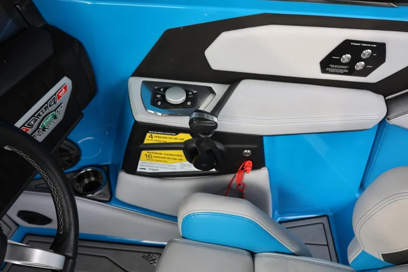 Slide: The Image of 2022 Nautique Super Air Nautique S23 touchscreen display with Bluetooth and audio controls. - 28