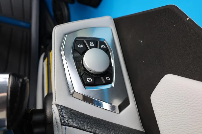 Slide: The Image of 2022 Nautique Super Air Nautique S23 boat on trailer, blue and white design. - 40