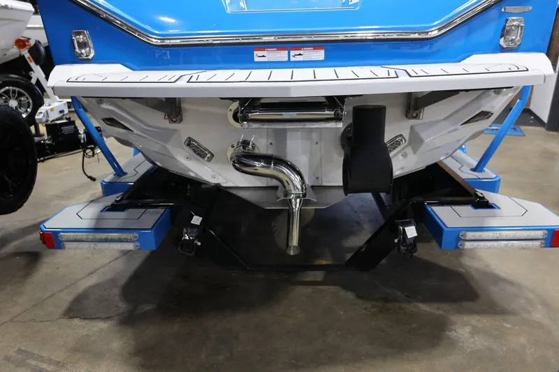 Slide: The Image of Rear view of 2022 Nautique Super Air Nautique S23 boat, showcasing its sleek design and features. - 62