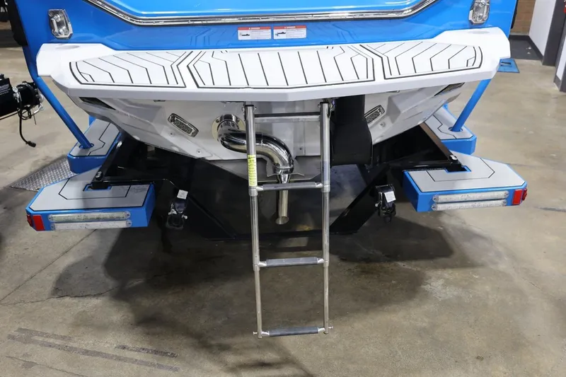 Slide: The Image of 2022 Nautique Super Air Nautique S23 boat rear view with swim platform and ladder. - 81