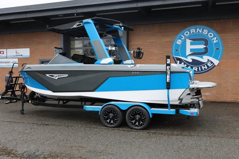 Slide: The Image of 2022 Nautique Super Air Nautique S23 boat in blue and gray at Bjornson Marine. - 82