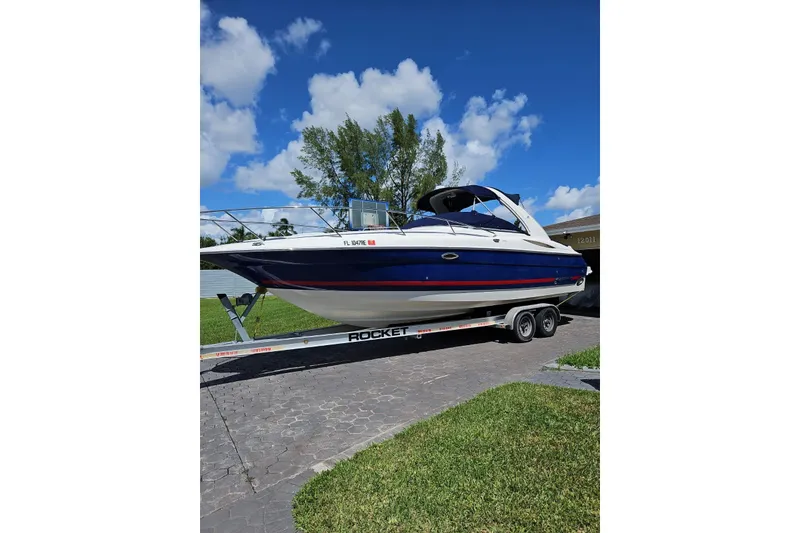 Slide: The Image of 2006 Monterey 298SC Super Sport boat with dual propellers, rear view. - 12