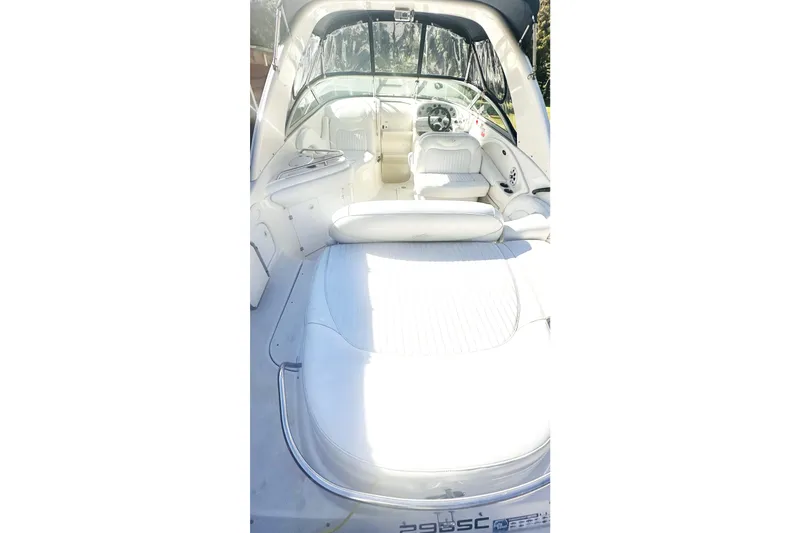 Slide: The Image of 2006 Monterey 298SC Super Sport boat with blue and white exterior on a trailer. - 3