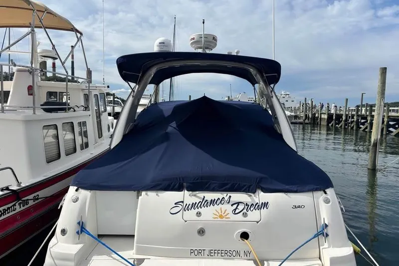 Slide: The Image of 2004 Sea Ray 320 Sundancer docked at Port Jefferson, NY, covered and ready for adventure. - 7