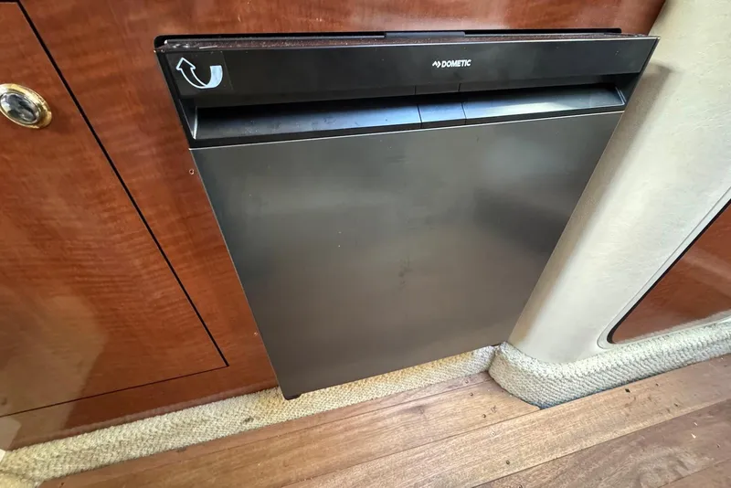 Slide: The Image of Dometic fridge in 2004 Sea Ray 280 Sundancer boat interior, wood paneling. - 17