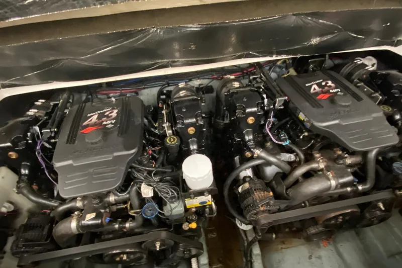 Slide: The Image of Engine compartment of a 2004 Sea Ray 280 Sundancer with twin MerCruiser 4.3 MPI engines. - 21