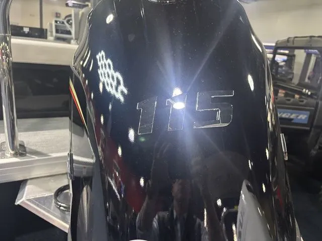 Slide: The Image of Close-up of a 115 HP outboard motor on a Godfrey Pontoon. - 12