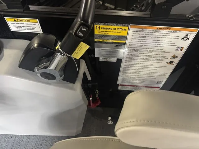 Slide: The Image of Interior of Godfrey Pontoons Xperience 2086 SFLX, control console and warning labels. - 23