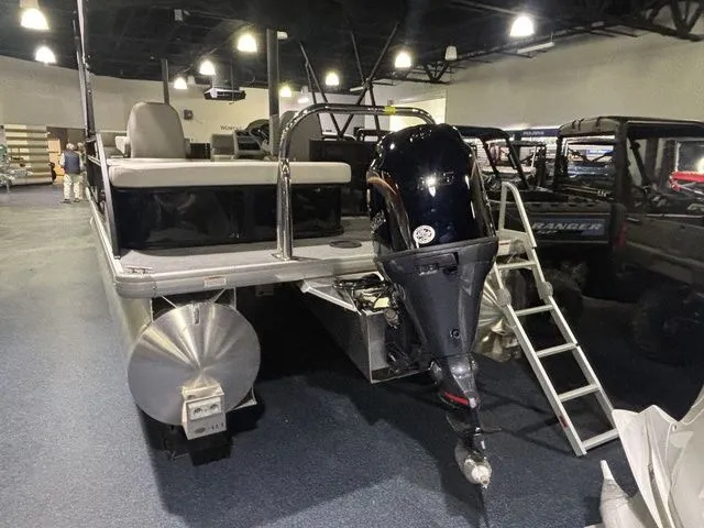 Slide: The Image of 2026 Godfrey Pontoons Xperience 2086 SFLX with outboard motor in showroom. - 6